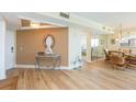 Inviting living space featuring elegant decor, wood floors, and tranquil views into other rooms at 5729 Puerta Del Sol S Blvd # 185, St Petersburg, FL 33715