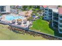 A luxurious pool with tiki umbrellas offers a relaxing retreat by the water at 5729 Puerta Del Sol S Blvd # 185, St Petersburg, FL 33715