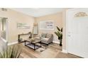 Cozy living room features modern flooring, neutral tones, stylish furnishings, and ample natural light at 219 80Th Ne Ave, St Petersburg, FL 33702