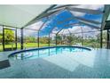 Enjoy a refreshing dip in this lovely enclosed pool with great views at 2324 Hayworth Rd, Port Charlotte, FL 33952