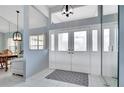 Bright entryway with tiled floor, double doors, and views to dining and living areas at 23420 Peachland Blvd, Port Charlotte, FL 33954