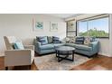 Cozy living room featuring stylish furniture, hardwood floors, and natural light at 2615 Cove Cay Dr # 409, Clearwater, FL 33760
