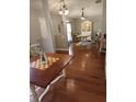 Inviting dining room with wood floors, stylish furnishings, and ample natural light at 404 Oakmount Rd, Clearwater, FL 33765