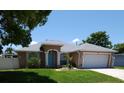 Charming single-story home with well-maintained lawn and neutral exterior paint at 404 Oakmount Rd, Clearwater, FL 33765