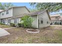 Exterior side view of condo showing landscaping and residential setting at 602 Lynchburg Dr, Brandon, FL 33511
