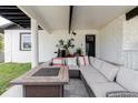 Inviting outdoor patio with ample seating, perfect for relaxing and entertaining guests at 7404 Bay Dr, Tampa, FL 33635