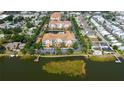 Aerial view of condo community, lake, and surrounding neighborhood at 7901 Seminole Blvd # 1103, Seminole, FL 33772