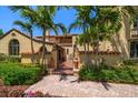 Detailed front exterior of home showing lush landscaping and unique Spanish-style terracotta roofing at 843 17Th N Ave, St Petersburg, FL 33704