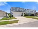 Charming two-story home with a well-manicured lawn and a two-car garage at 8595 Prairie Creek Dr, New Port Richey, FL 34655