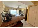 Relax in this stylish living area with beach views, tile floors, and comfortable seating at 880 Mandalay Ave # N109, Clearwater Beach, FL 33767