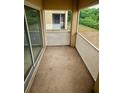 Cozy balcony area with a view of lush greenery, providing a tranquil outdoor space at 9516 Newdale Way # 101, Riverview, FL 33578