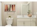 Contemporary bathroom with a white vanity, brushed nickel fixtures, and neutral decor at 9657 Runaway Breeze Dr, Land O Lakes, FL 34637