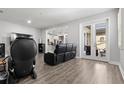 Bright living room featuring light grey floors and stylish furniture at 11308 Temperley Pl, Tampa, FL 33625