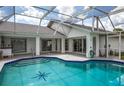 The screened pool and patio offer a relaxing outdoor experience at 128 Torrington St, Port Charlotte, FL 33954