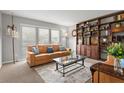 Cozy living room features stylish shelving and comfortable seating at 14542 Anchorage Cir, Seminole, FL 33776