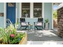 Close-up of a cozy front porch with chairs and decorative planters, adding charm and curb appeal at 3008 N 13Th St, Tampa, FL 33605