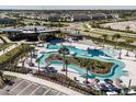 Community pool and amenity center with lazy river and lounge areas at 31356 Pendleton Landing Cir, Wesley Chapel, FL 33545