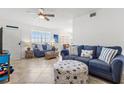 Inviting living area showcasing tile flooring, stylish furniture, and views from large windows at 445 Hamden Dr # 502, Clearwater Beach, FL 33767