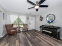 Inviting living room with hard surface floors, neutral paint, and a ceiling fan at 4721 W Iowa Ave, Tampa, FL 33616