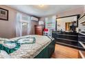 Cozy bedroom with wood floors, natural light, and neutral wall colors at 5004 Suwannee Dr, New Port Richey, FL 34652