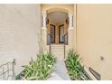 Inviting entryway with a tiled staircase framed by columns and lush greenery at 6404 Mayra Shores Ln, Apollo Beach, FL 33572
