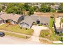 Beautiful single-story home with well-kept lawn and landscaping in a quiet, tree-lined neighborhood at 8712 Ashbury Dr, Hudson, FL 34667