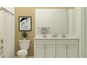 Bright bathroom with double vanity, granite counters, and shower with tub combination at 12054 Violet Jasper Dr, Parrish, FL 34219