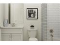 Neat bathroom featuring a vanity with a solid-surface counter and subway tile in the shower at 12062 Violet Jasper Dr, Parrish, FL 34219