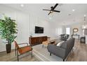 Bright living room with a ceiling fan, a modern sofa, and an open layout design at 121 E Warren Ave # 1, Tampa, FL 33602