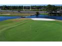 Distant view of house by the water adjacent to golf course and divided highway at 219 Galaxy Ave, Spring Hill, FL 34606