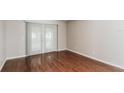 Bright bedroom with hardwood floors and sliding doors leading to outdoor space at 2203 Malaga Ave, Spring Hill, FL 34609