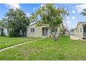Charming single-story home with a well-maintained lawn and mature trees providing ample shade at 2435 37Th N Ave, St Petersburg, FL 33713
