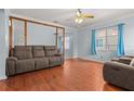 Inviting living room featuring hardwood floors, a ceiling fan, and comfortable seating at 2435 37Th N Ave, St Petersburg, FL 33713
