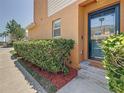 Charming front entrance with well-maintained landscaping at 2530 Sandy Beach Ln, Clearwater, FL 33763