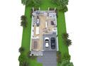 Detailed first floor plan showcases an open layout, integrating the kitchen, dining, and living areas, plus a two-car garage at 2805 W Wallace Ave, Tampa, FL 33611