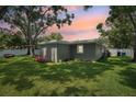 Spacious backyard with a well-maintained lawn, perfect for outdoor activities and relaxation at 3302 W Beaumont St, Tampa, FL 33611