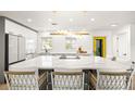 Spacious kitchen with a large island, stylish pendant lighting, and a bright, modern design at 3436 Manatee Se Dr, St Petersburg, FL 33705