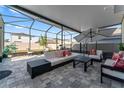 Enjoy outdoor living on this beautiful screened patio with ample seating at 35780 Sunflower Hill Dr, Zephyrhills, FL 33541