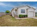 Charming single-Gathering home with a front yard featuring manicured shrubs and a walkway to the entrance at 3730 Elmwood Dr, Holiday, FL 34691
