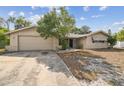 Inviting single-story home with attached garage and well-maintained front yard, offering a welcoming curb appeal at 8907 Pandora Ln, Port Richey, FL 34668