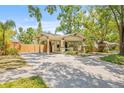 Charming home with a spacious driveway and a welcoming covered porch at 906 E Broad St, Tampa, FL 33604