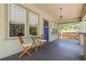 Inviting front porch with seating area, ideal for relaxing outdoors at 906 E Broad St, Tampa, FL 33604