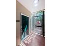 Apartment entrance featuring a green door with secure gate and visible unit number 108 at 1216 S Missouri Ave # 108, Clearwater, FL 33756