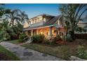 Charming home with a spacious front porch, beautiful pillars, and lovely landscaping at 146 8Th Ne Ave, St Petersburg, FL 33701