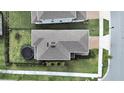 Aerial view of the home showing the roof, backyard, and trampoline at 17737 Everlong Dr, Land O Lakes, FL 34638