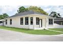 Inviting single-story home featuring a crisp exterior paint, neat lawn, and simple landscaping at 2504 E 28Th Ave, Tampa, FL 33605