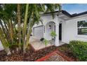 Beautiful home exterior showcasing a well-manicured yard and attached garage at 2662 Oakbrook Dr, Largo, FL 33770