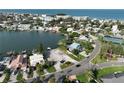 Scenic aerial view of land available for purchase, near water, surrounded by residential neighborhood, offering investment potential at 305 Harbor Dr, Indian Rocks Beach, FL 33785