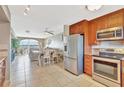 Well-equipped kitchen featuring stainless steel appliances and granite countertops at 4939 Floramar Ter # 504, New Port Richey, FL 34652