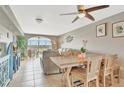 Cozy living room and dining area with water views and abundant natural light at 4939 Floramar Ter # 504, New Port Richey, FL 34652